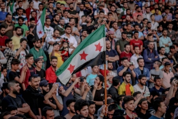 Syrian flag in a crowd