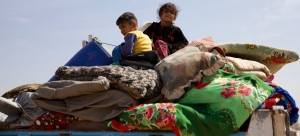 Internally displaced family leaving conflict zone in Syria to look for a safer place within the borders